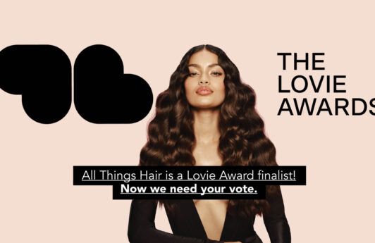 Banner photo with dark-haired woman and text that says All Things Hair is a Lovie Award finalist